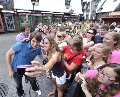 Oliver and James Phelps (L to R) – who portray the mischievous Weasley brothers, George and Fred respectively, in the Harry Potter films – stopped to greet fans and take photos with eager guests in Hogsmeade at The Wizarding World of Harry Potter while visiting Universal Orlando Resort on Thursday, June 9, 2011. The Wizarding World of Harry Potter, which celebrated its grand opening nearly one year ago, is the most spectacular-themed environment ever created.

 

HARRY POTTER, characters, names and related 
