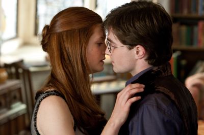 Harry and Ginny kiss. George Weasley interupts them. Burrows Kitchen. 
